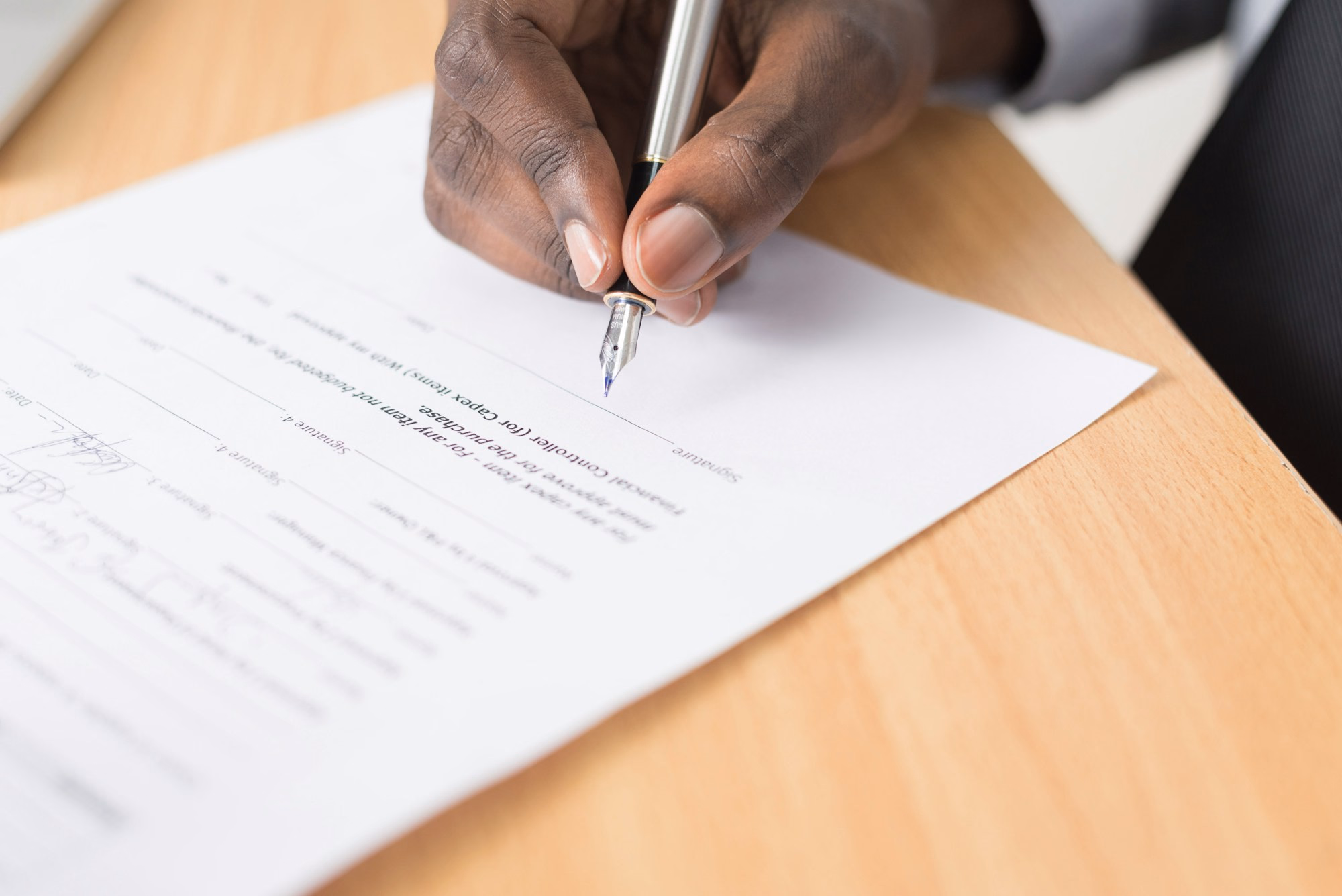 Two business professionals formalising an agreement