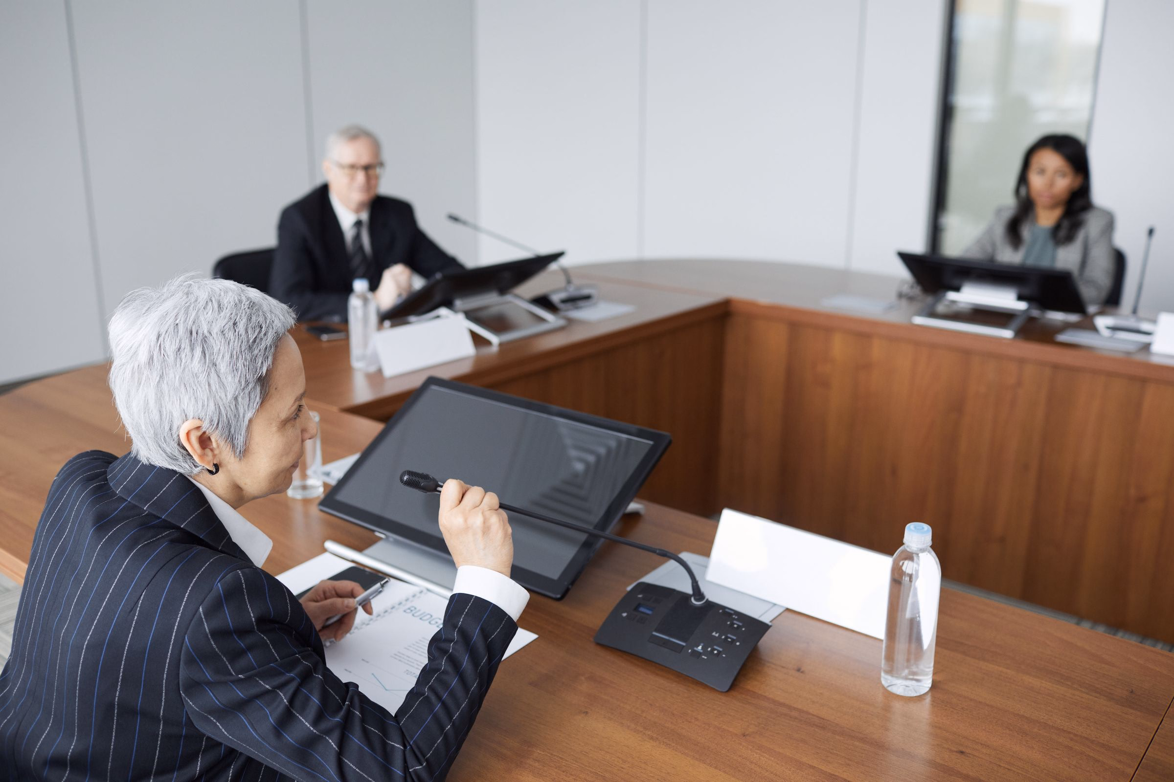 Senior executives taking part in a formal board discussion