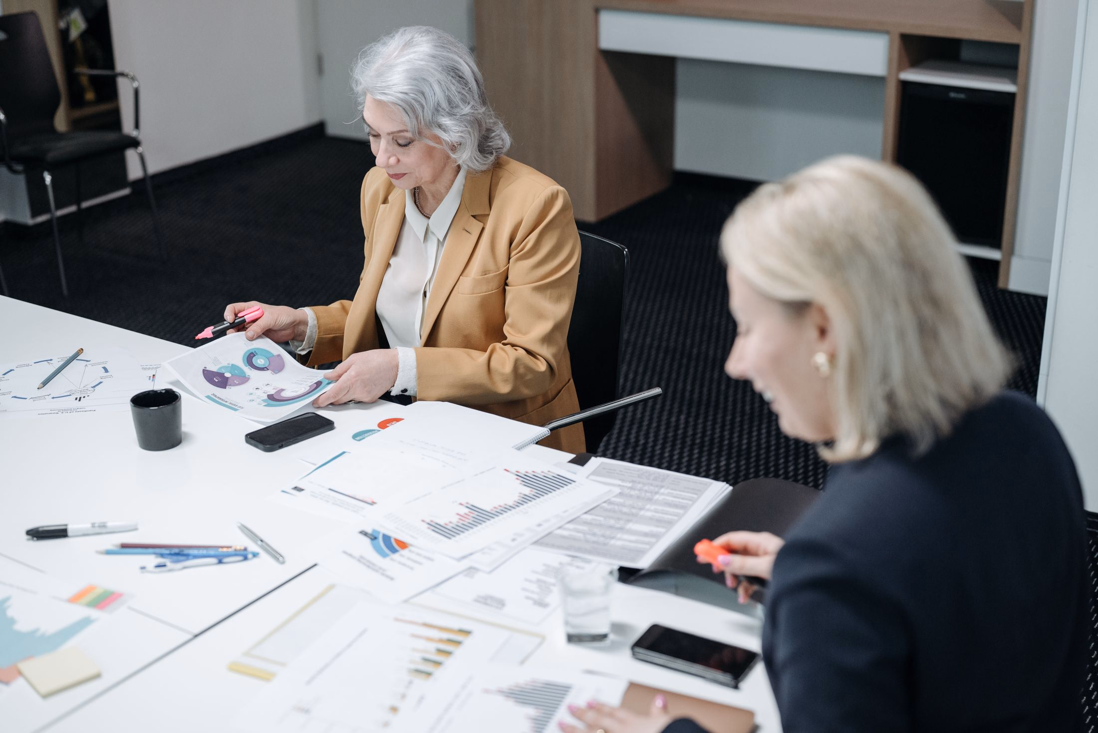 Experienced professionals collaborating around financial analysis