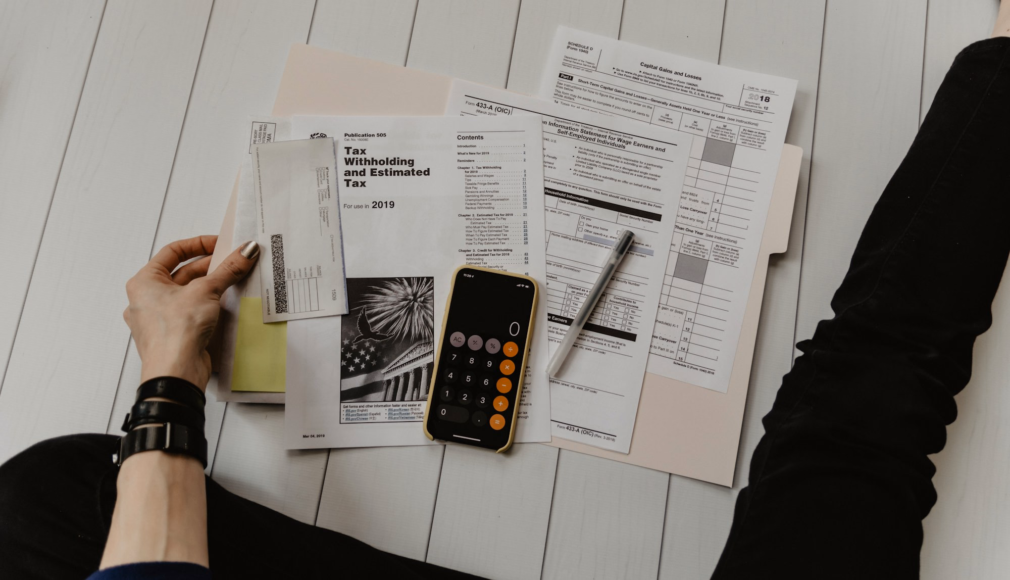 Calculator and financial documents on a work desk